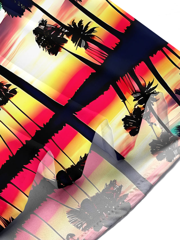 Men's Hawaiian coconut trees sunset short sleeve shirt lifestyle shot for tropical beach vacation