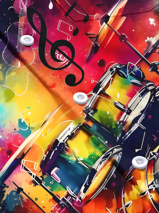 Men's short sleeve tie dye shirt with drum kit print, close-up detail view of pocket stitching