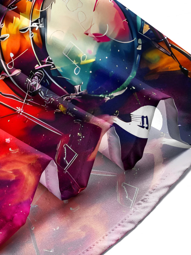 Men's tie dye short sleeve shirt with drum kit print, lifestyle shot of man wearing it outdoors