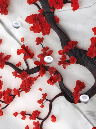 Men's short sleeve floral shirt detail close-up showing button stitching and fabric texture
