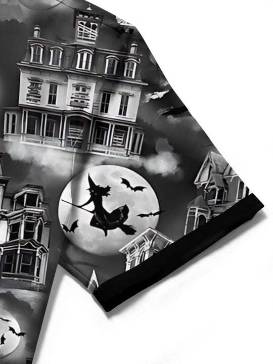 Men's black short sleeve shirt with haunted house detail, close-up view