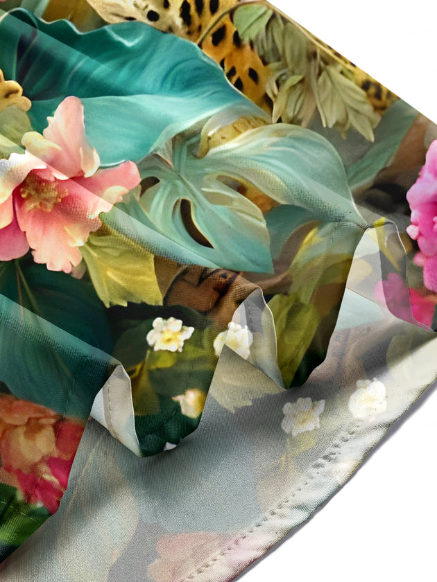 Men's floral short sleeve shirt in lifestyle setting, front view