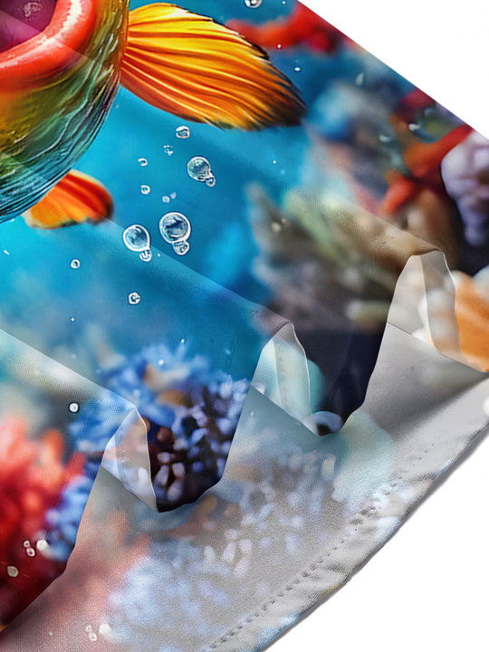 Men's Hawaiian fish print short sleeve shirt lifestyle shot at tropical beach vacation