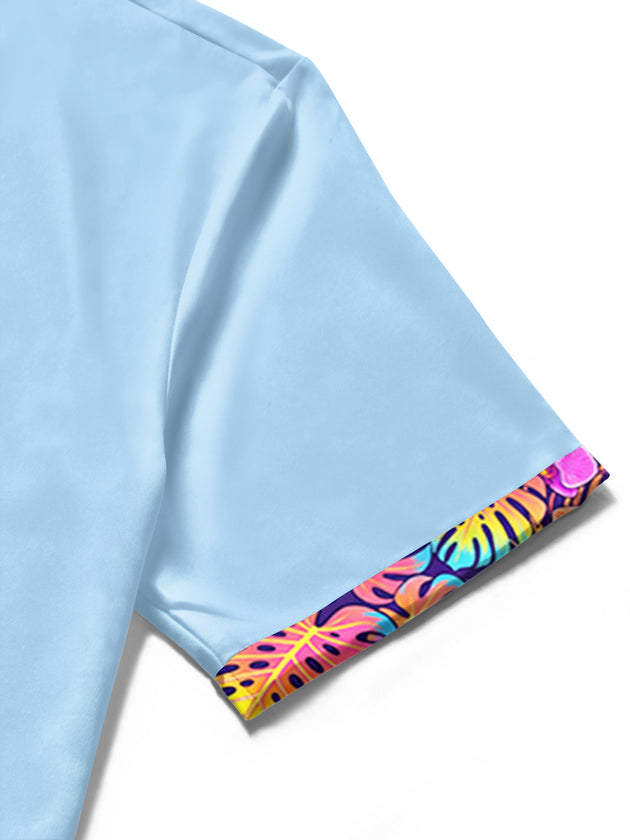 Men's blue Hawaiian tropical floral leaves short sleeve shirt close-up fabric detail