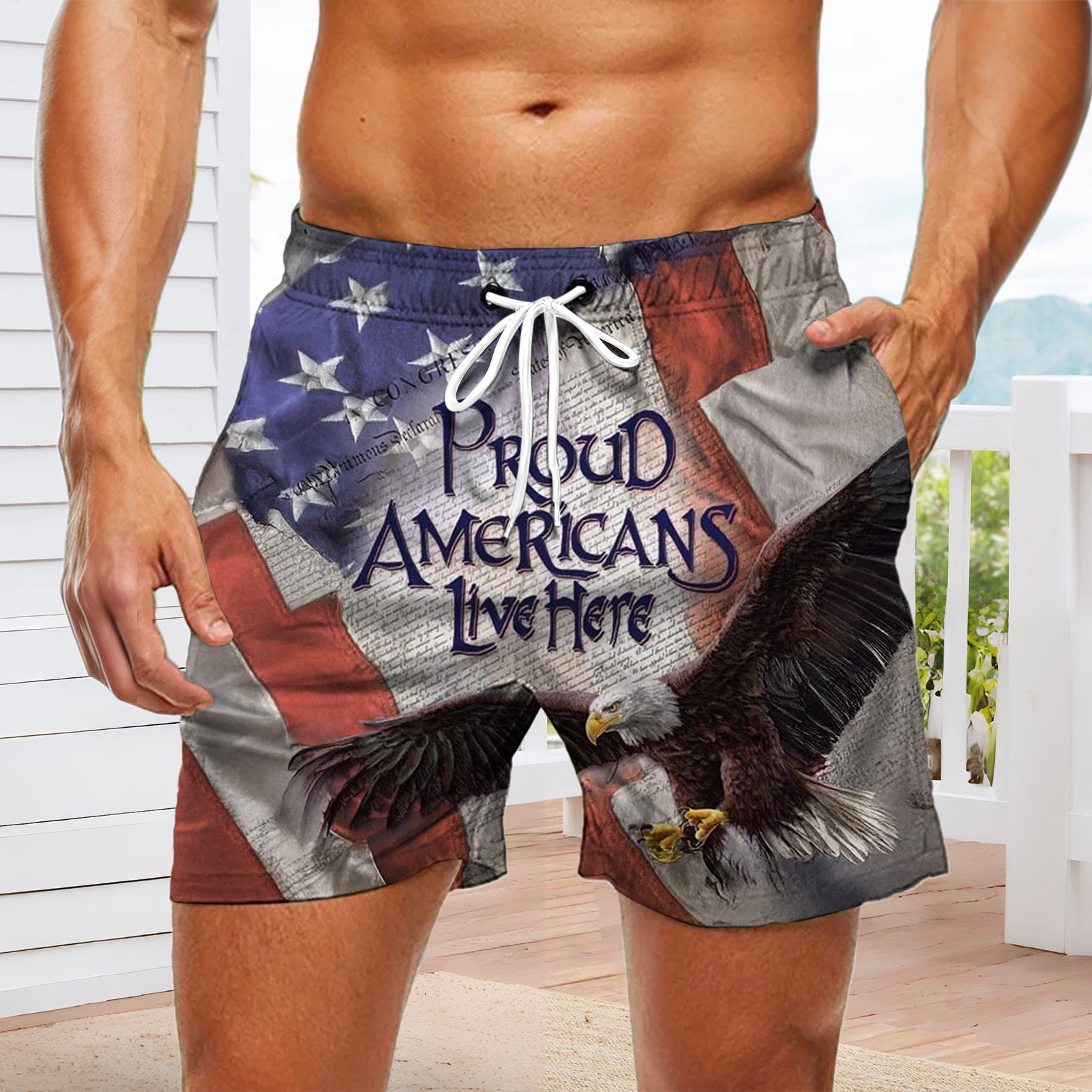 Men casual American flag print board shorts lifestyle view for Independence Day beach scene