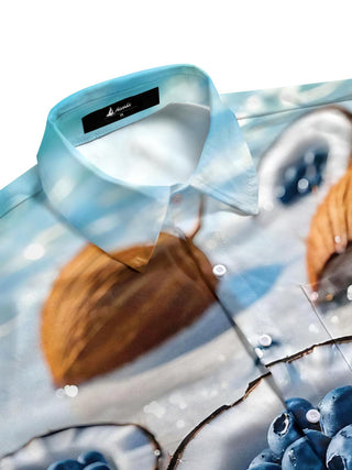 Men's cobalt half sleeve shirt with blueberry coconut print in side view