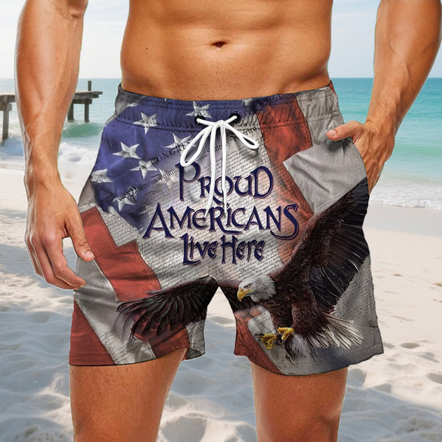 Men wearing American flag print casual shorts at seaside boardwalk for Independence Day lifestyle scene