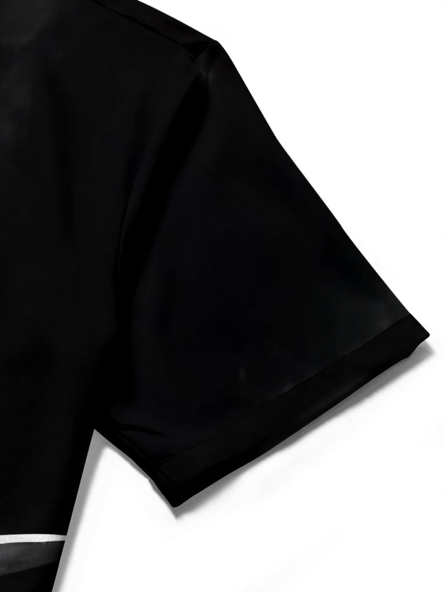 Men's black short sleeve shirt with drum set music print close-up detail