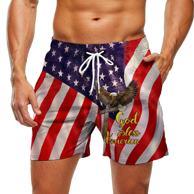 Men wearing American flag print casual shorts at coastal party for Independence Day lifestyle scene