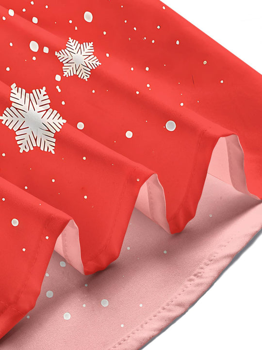 Men wearing funny Christmas print short sleeve shirt at holiday party lifestyle shot